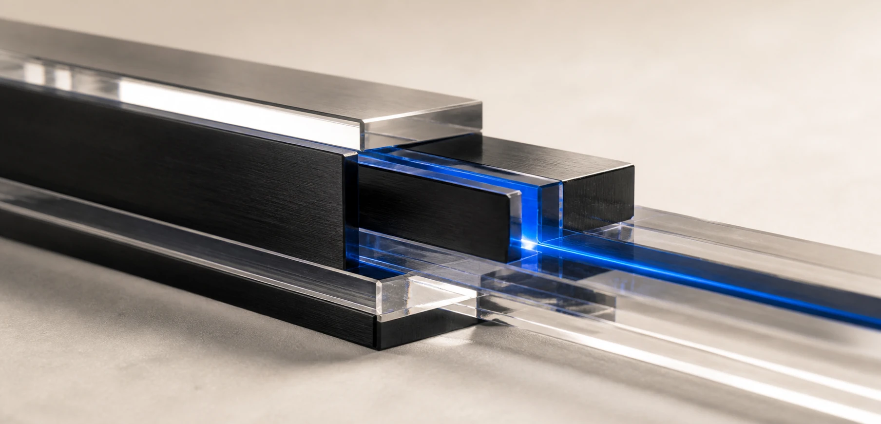 A precise connection between black metal and transparent acrylic components illuminated in blue